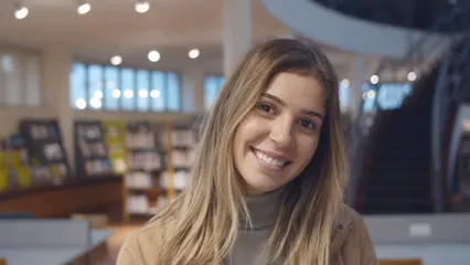 Horizontal video: A young female student in a library 5940675. Duration: 21 seconds. Resolution: 3840x2160