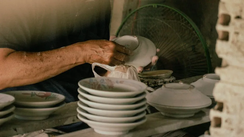 Craftsman Preparing Ceramic Plates in Workshop