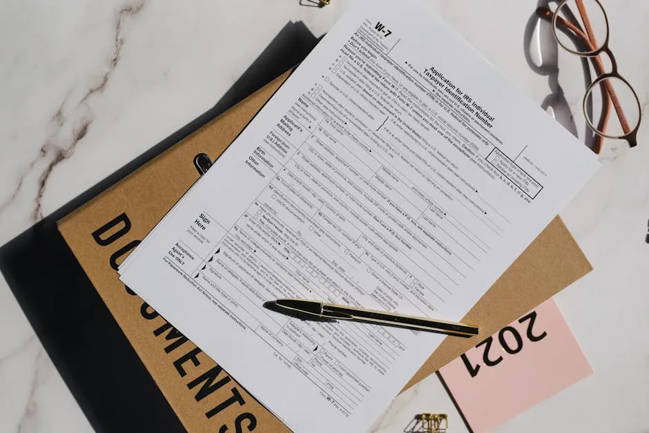 Ballpen on a Blank Document Beside an Eyeglasses