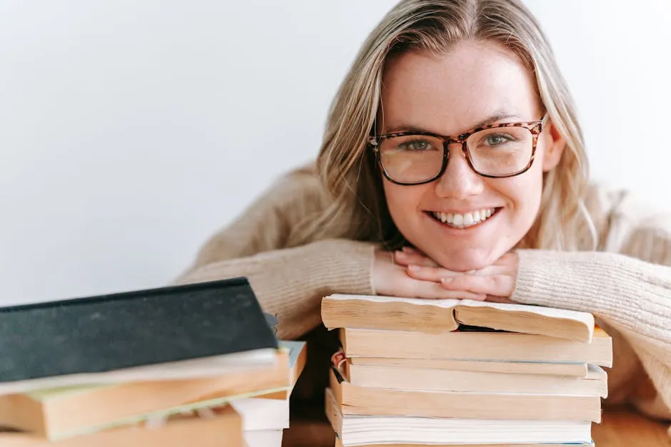Smiling Woman Leaning on Stack of Books