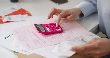 Horizontal video: A woman using calculator 7710754. Duration: 12 seconds. Resolution: 4096x2160