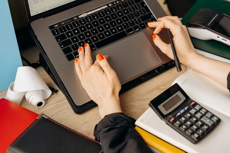 Hands of a Woman Using a Laptop