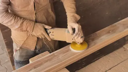 Horizontal video: A man is sanding wood with a sander 20374770. Duration: 17 seconds. Resolution: 1920x1080