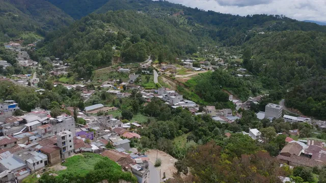 Horizontal video: Aerial view of a small town in the mountains 28322217. Duration: 16 seconds. Resolution: 3840x2160