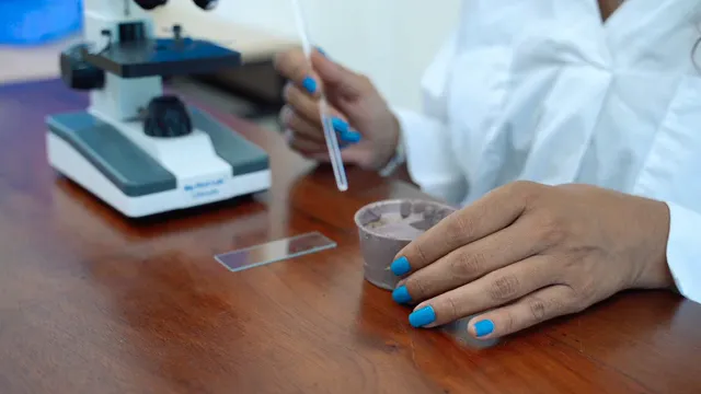 Horizontal video: A person preparing a sample on a glass slide 8392605. Duration: 12 seconds. Resolution: 1920x1080
