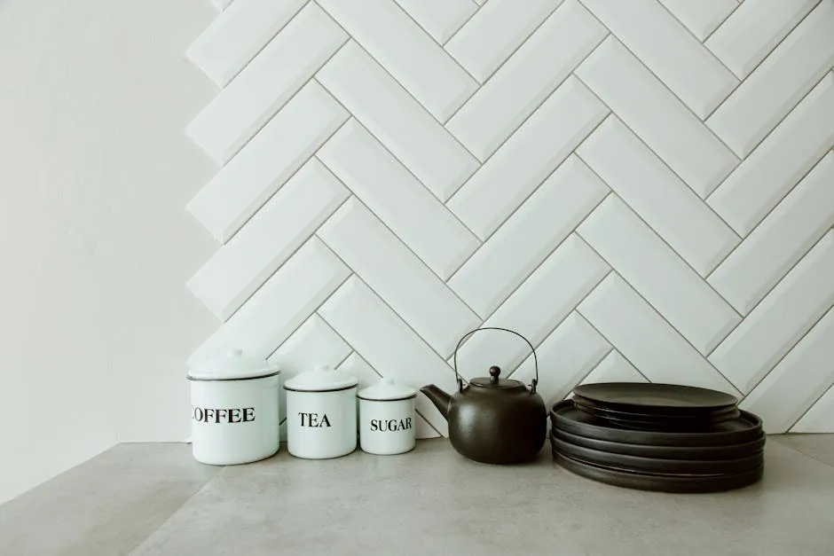 Coffee, Tea and Sugar Containers, Kettle and Plates on Kitchen Counter