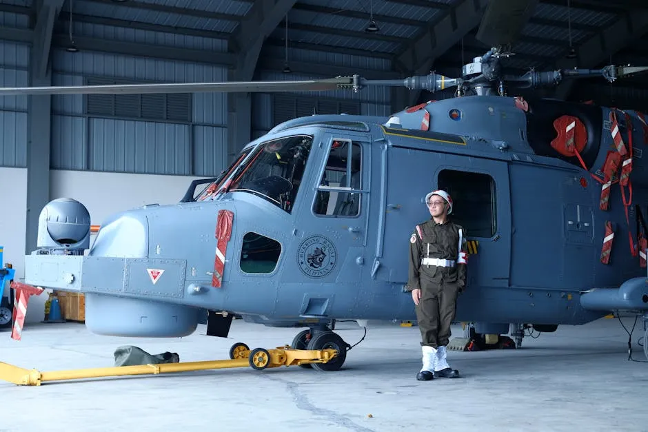 Navy Trainee Standing by a Helicopter