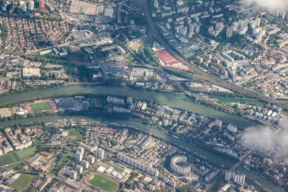 Aerial View of Urban Landscape with River and Buildings