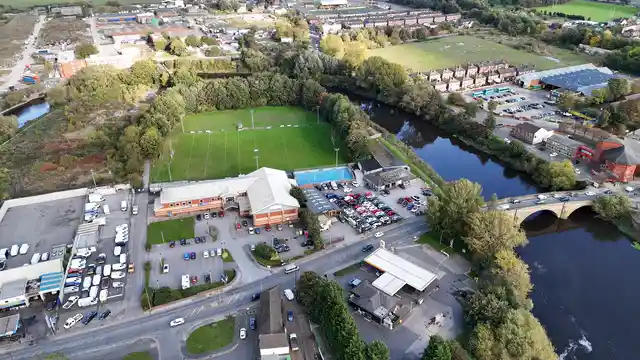 Horizontal video: Aerial view over scenic town and river landscape 28890181. Duration: 60 seconds. Resolution: 3840x2160