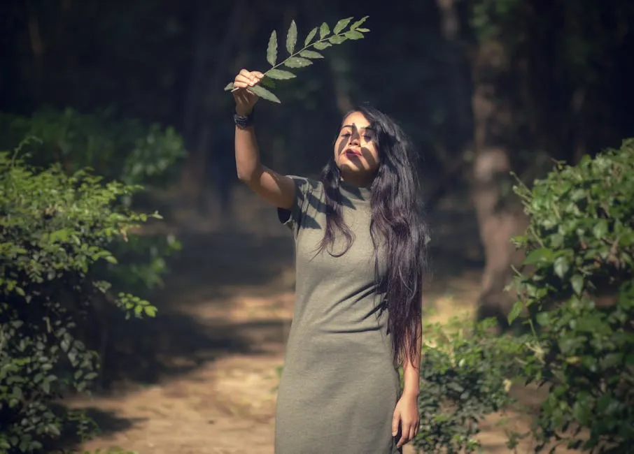 Photo Of Woman Holding Leaf