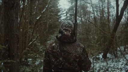 Horizontal video: A hunter walking in the snow 6201066. Duration: 28 seconds. Resolution: 3840x2160