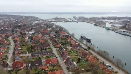 Horizontal video: Aerial footage of a town 7056492. Duration: 15 seconds. Resolution: 1920x1080