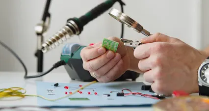 Horizontal video: A electrician is working using pliers and magnifying glass 7314025. Duration: 33 seconds. Resolution: 4096x2160