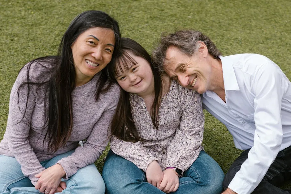 A Happy Family Sitting on the Grass