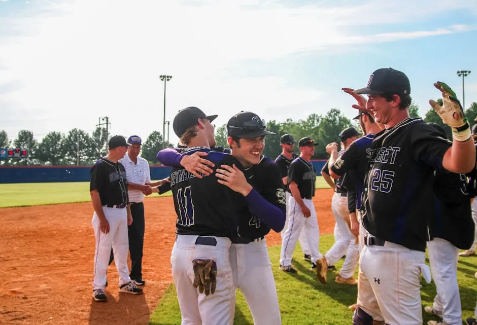 Two Men Hugging Each Other On Baseball Field