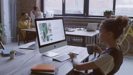 Horizontal video: A woman working on a computer base on her notes 3249675. Duration: 14 seconds. Resolution: 3840x2160