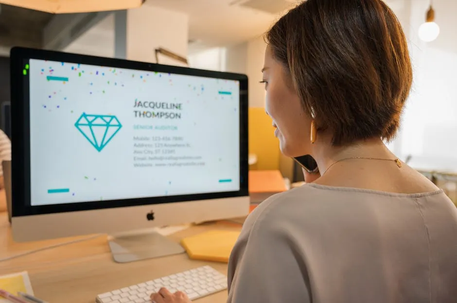 Woman Wearing Beige Shirt in Front of Silver Imac Computer 