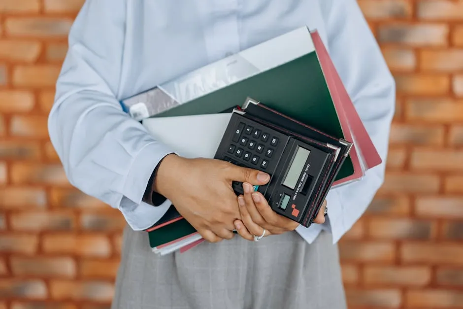 A Person Holding Black Calculator