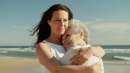 Horizontal video: A middle aged woman hugging her mother 8817769. Duration: 7 seconds. Resolution: 3840x2160