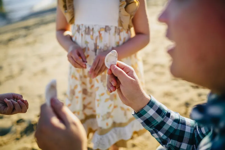 Mother with Her Daughters Playing with Seashells
