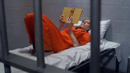 Horizontal video: Prisoner reading a book 6124572. Duration: 11 seconds. Resolution: 1920x1080