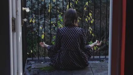 Horizontal video: Back view of woman meditating on balcony 6258093. Duration: 10 seconds. Resolution: 3840x2160