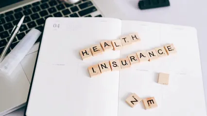 Horizontal video: Scrabble tiles arranged as health insurance 7164231. Duration: 9 seconds. Resolution: 1920x1080