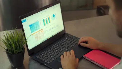 Horizontal video: Looking at graphs using a laptop 7947507. Duration: 7 seconds. Resolution: 1920x1080