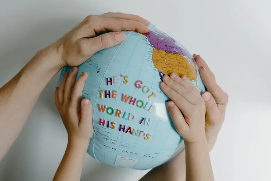 A Persons Hands Holding a Blue Globe 