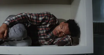 Horizontal video: Man lying inside a cabinet feeling scared 8458645. Duration: 14 seconds. Resolution: 4096x2160