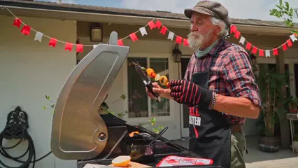 Horizontal video: Elderly man grilling vegetables and a hot dog 8523238. Duration: 22 seconds. Resolution: 1920x1080