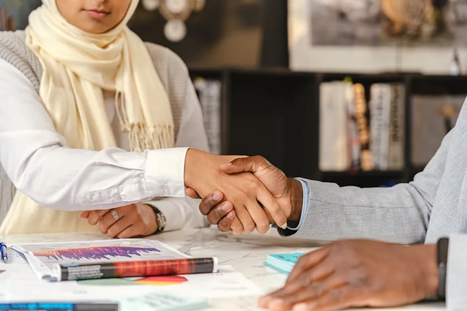Business People Shaking Hands during a Meeting
