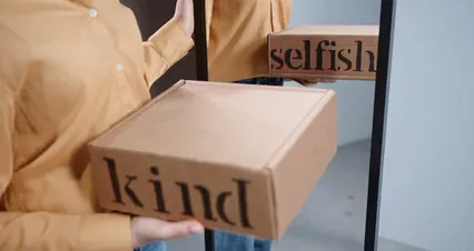 Horizontal video: Selfish and kind printed on a cardboard box 9196229. Duration: 20 seconds. Resolution: 4096x2160