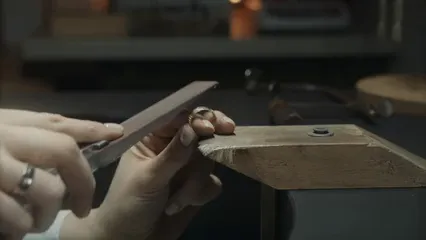 Horizontal video: A person polishing a ring 6262810. Duration: 15 seconds. Resolution: 3840x2160
