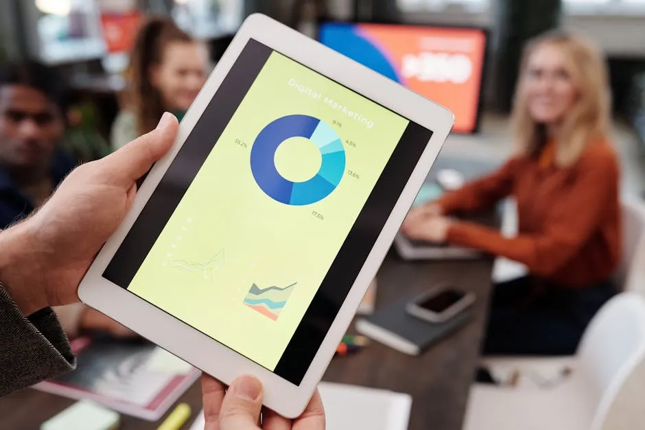 A Hand Holding a Tablet Device in Close-up Photography