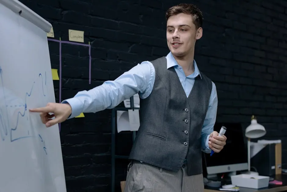 Businessman presenting data on a whiteboard in a contemporary office setting.