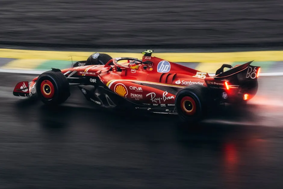 High-speed Formula 1 car racing on wet track showcasing power and precision.