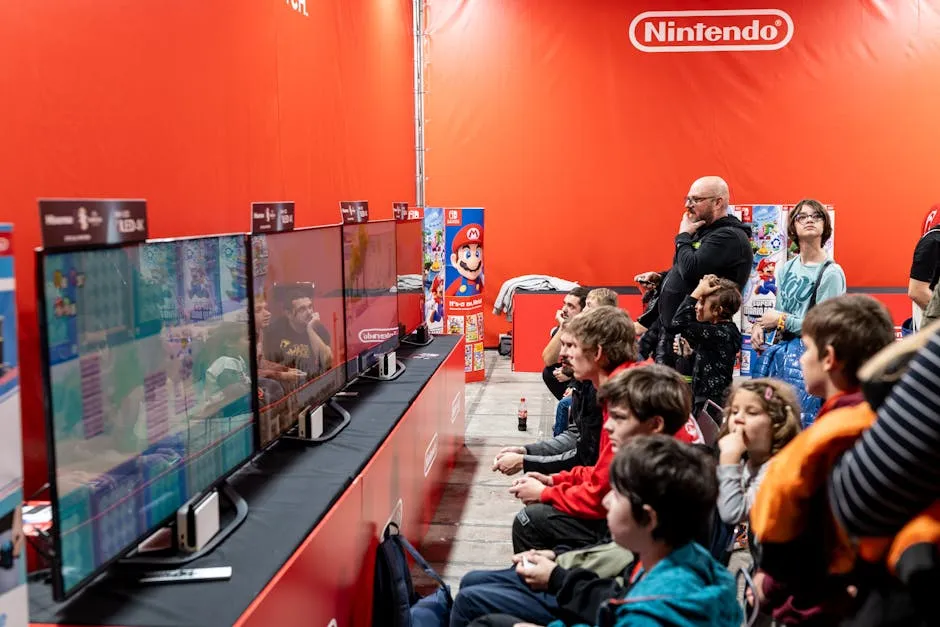 A lively group enjoys gaming at a Nintendo event in Zagreb, featuring multiple screens and vibrant atmosphere.