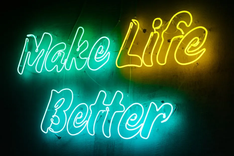 Vivid neon sign displaying the motivational message 'Make Life Better' in a colorful and eye-catching style.