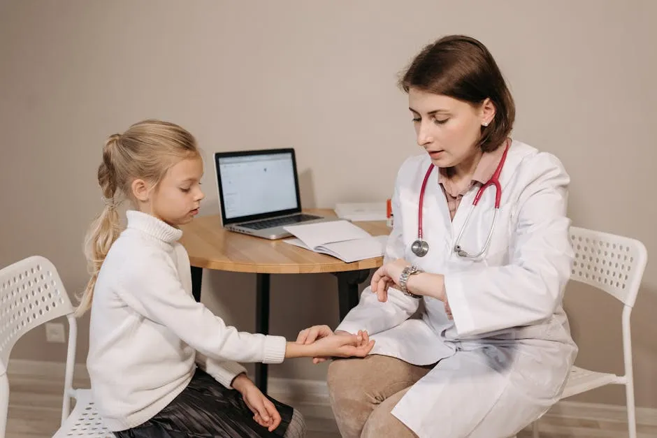 A doctor examines a young girl during a pediatric consultation in an indoor clinic setting.