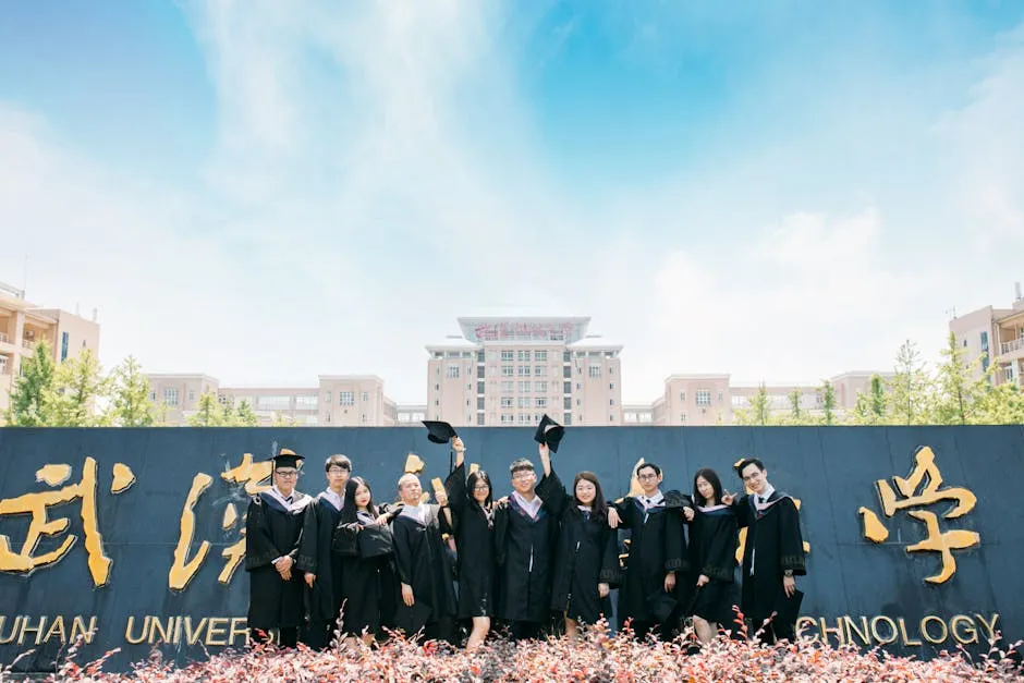 Group of graduates celebrating outdoors at Wuhan University of Technology.